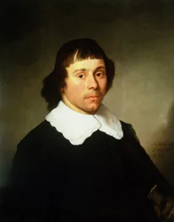 Portrait of a Young Man in a Black Costume with a White Lace Collar